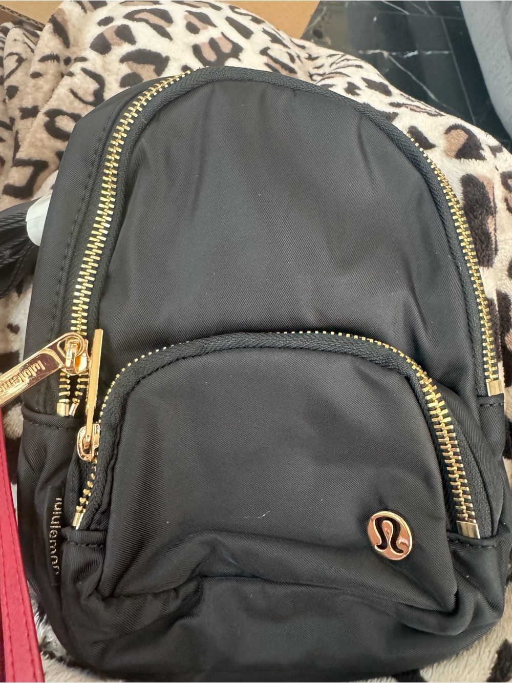 lululemon athletica Black Mini Backpack with Gold Accents